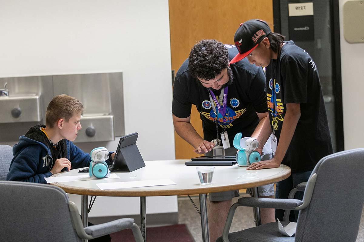 Students working with their robot in GenCyber Camp 2023.